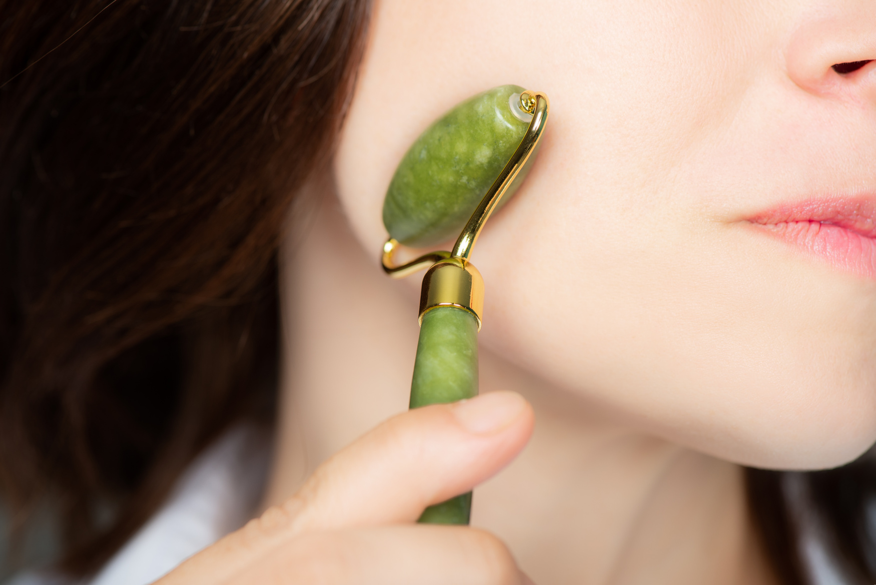 Woman with Jade Face Roller